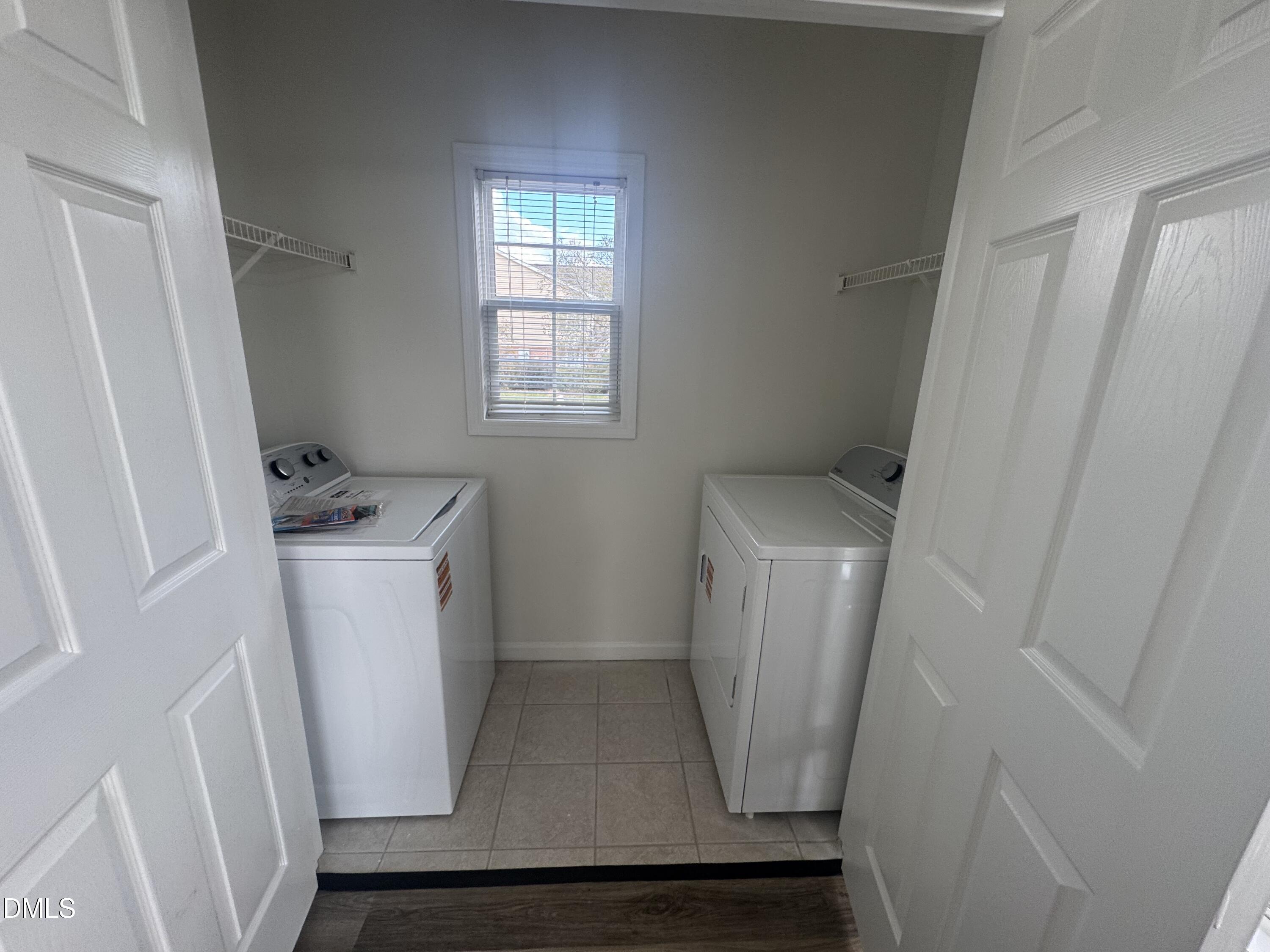 2511 Friedland Place, Unit 202 Raleigh, NC 27617 - Photo 13 of 19 a utility room with dryer and washer