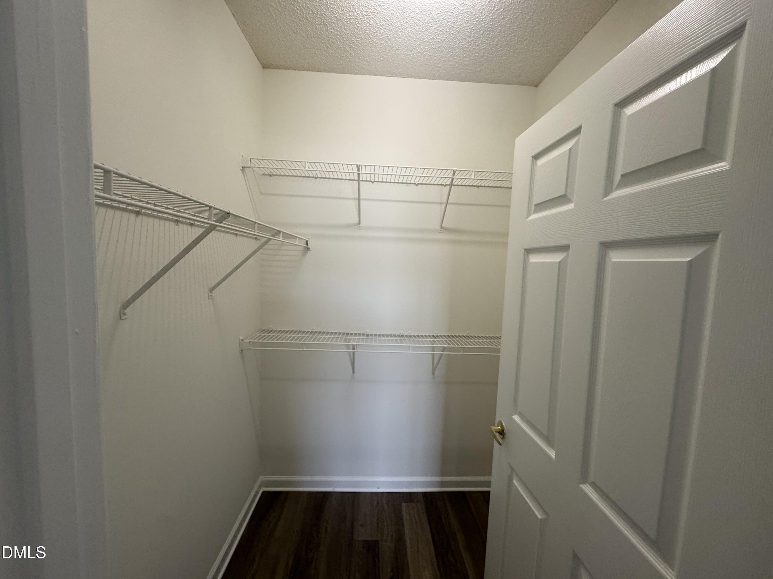 2511 Friedland Place, Unit 202 Raleigh, NC 27617 - Photo 16 of 19 a view of a room with racks on the wall