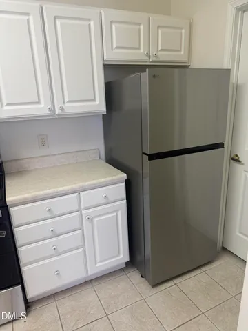 a stove top oven sitting inside of a kitchen