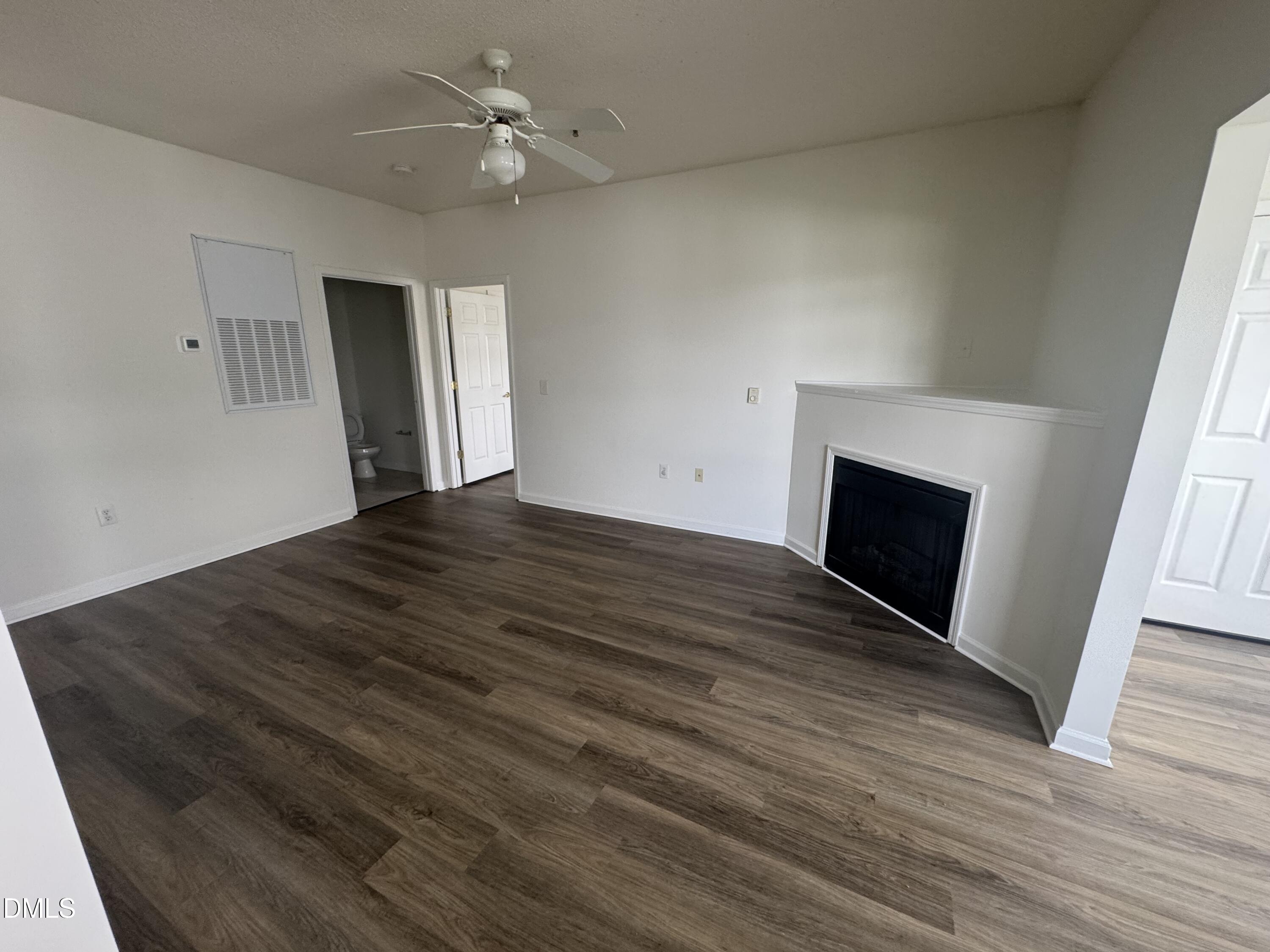 2511 Friedland Place, Unit 202 Raleigh, NC 27617 - Photo 9 of 19 wooden floor fireplace and natural light in room