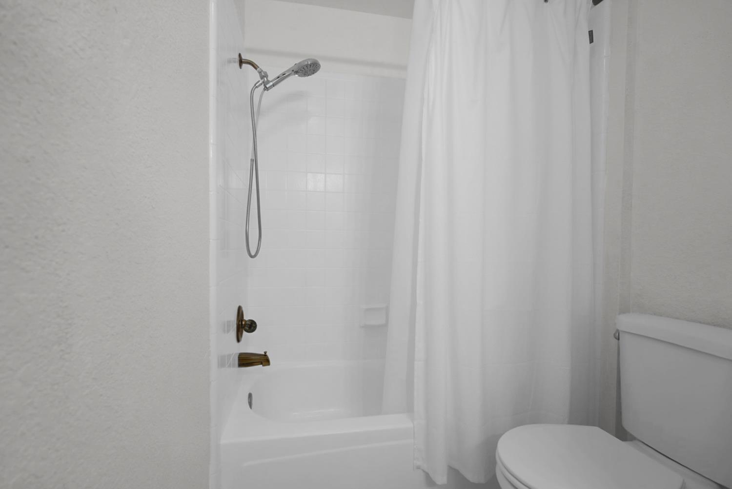 2195 Brigadoon Walk Manteca, CA 95336 - Photo 15 of 41 a bathroom with a shower and a toilet