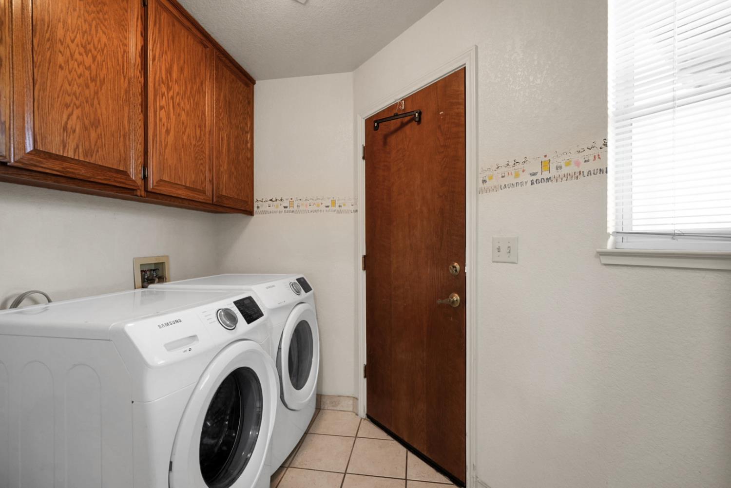 2195 Brigadoon Walk Manteca, CA 95336 - Photo 16 of 41 a utility room with dryer and washer