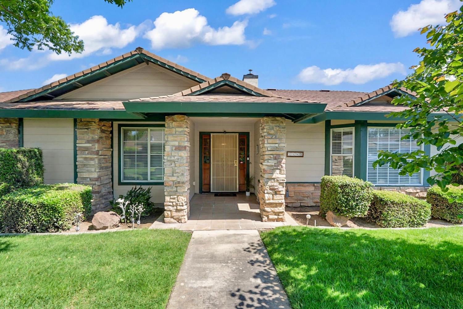 2195 Brigadoon Walk Manteca, CA 95336 - Photo 2 of 41 a front view of a house with garden