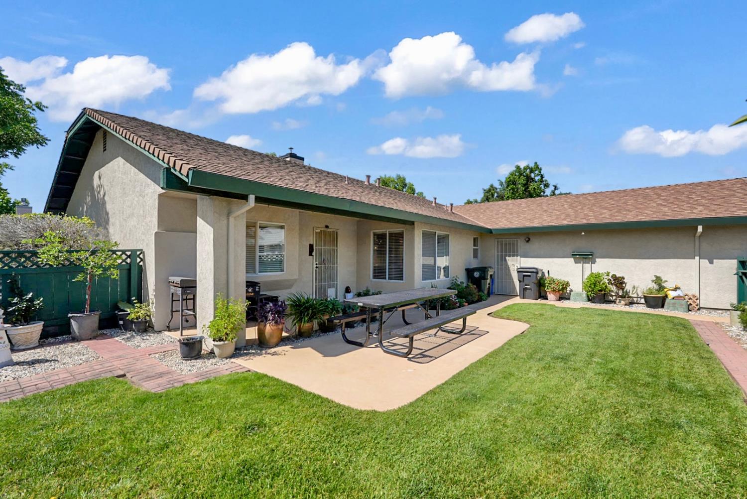 2195 Brigadoon Walk Manteca, CA 95336 - Photo 23 of 41 a front view of house with yard and outdoor seating