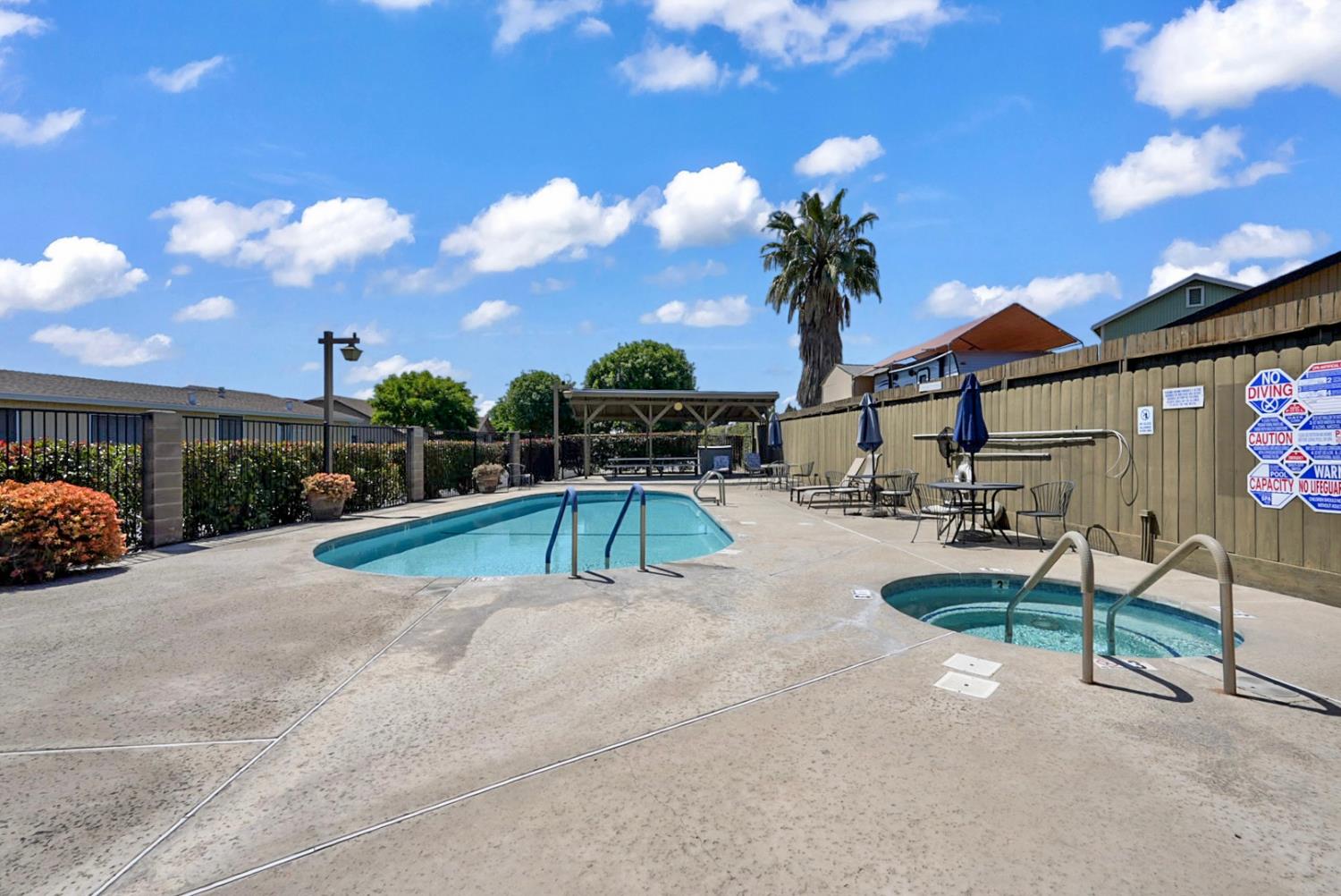 2195 Brigadoon Walk Manteca, CA 95336 - Photo 28 of 41 a view of a house with swimming pool and a yard