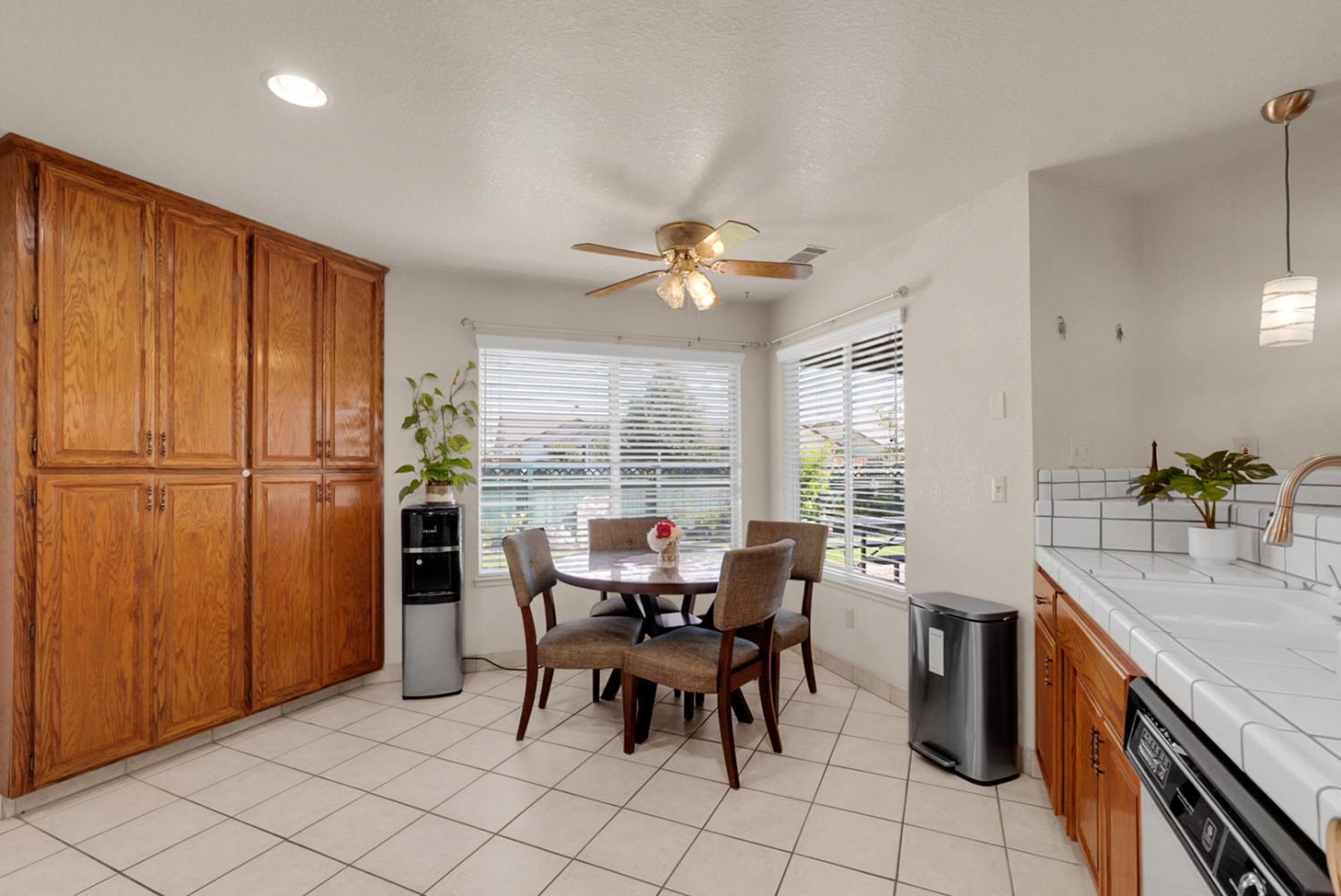 2195 Brigadoon Walk Manteca, CA 95336 - Photo 6 of 41 a view of a dining room with furniture window and outside view