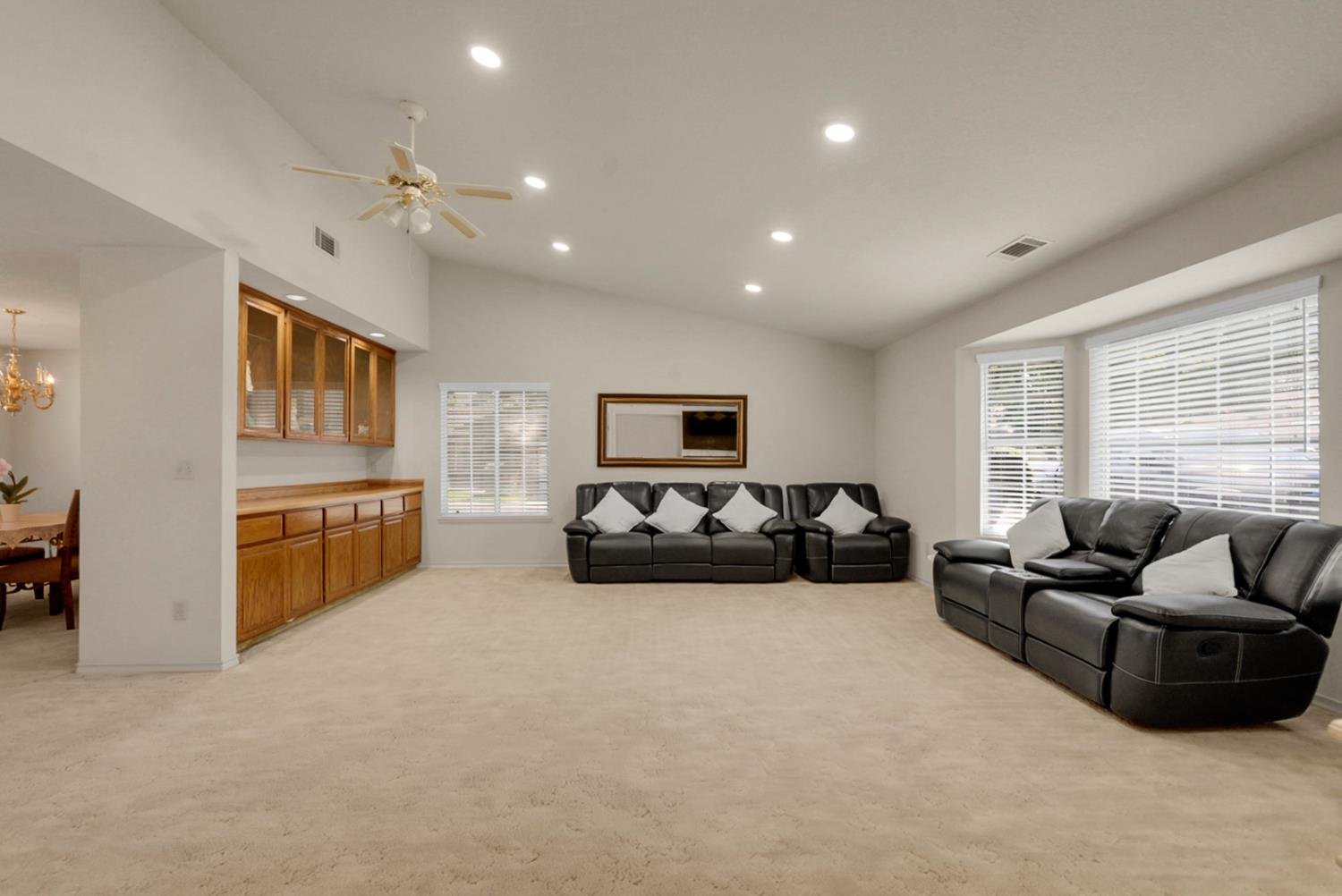 2195 Brigadoon Walk Manteca, CA 95336 - Photo 10 of 41 a living room with furniture ceiling fan and a window