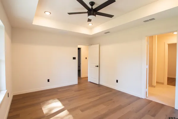 a bathroom with a granite countertop sink and mirror
