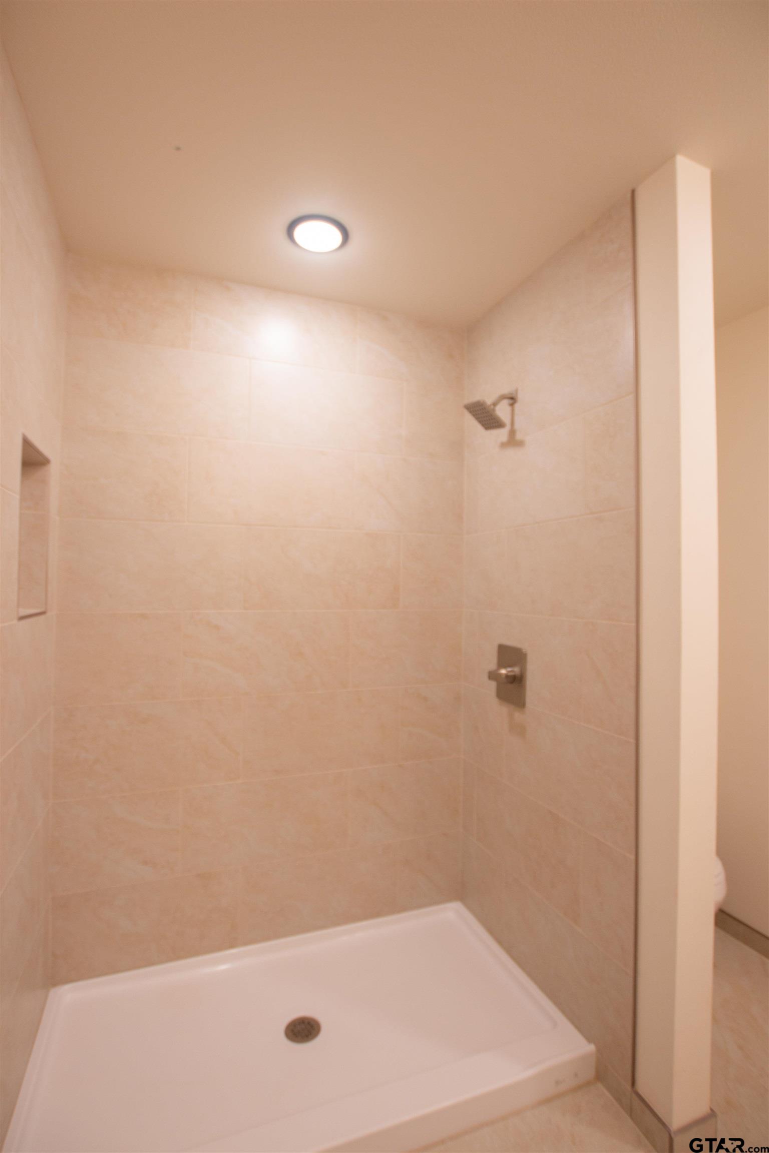 1108 Park Street Tyler, TX 75702 - Photo 22 of 27 a bathroom with a bathtub