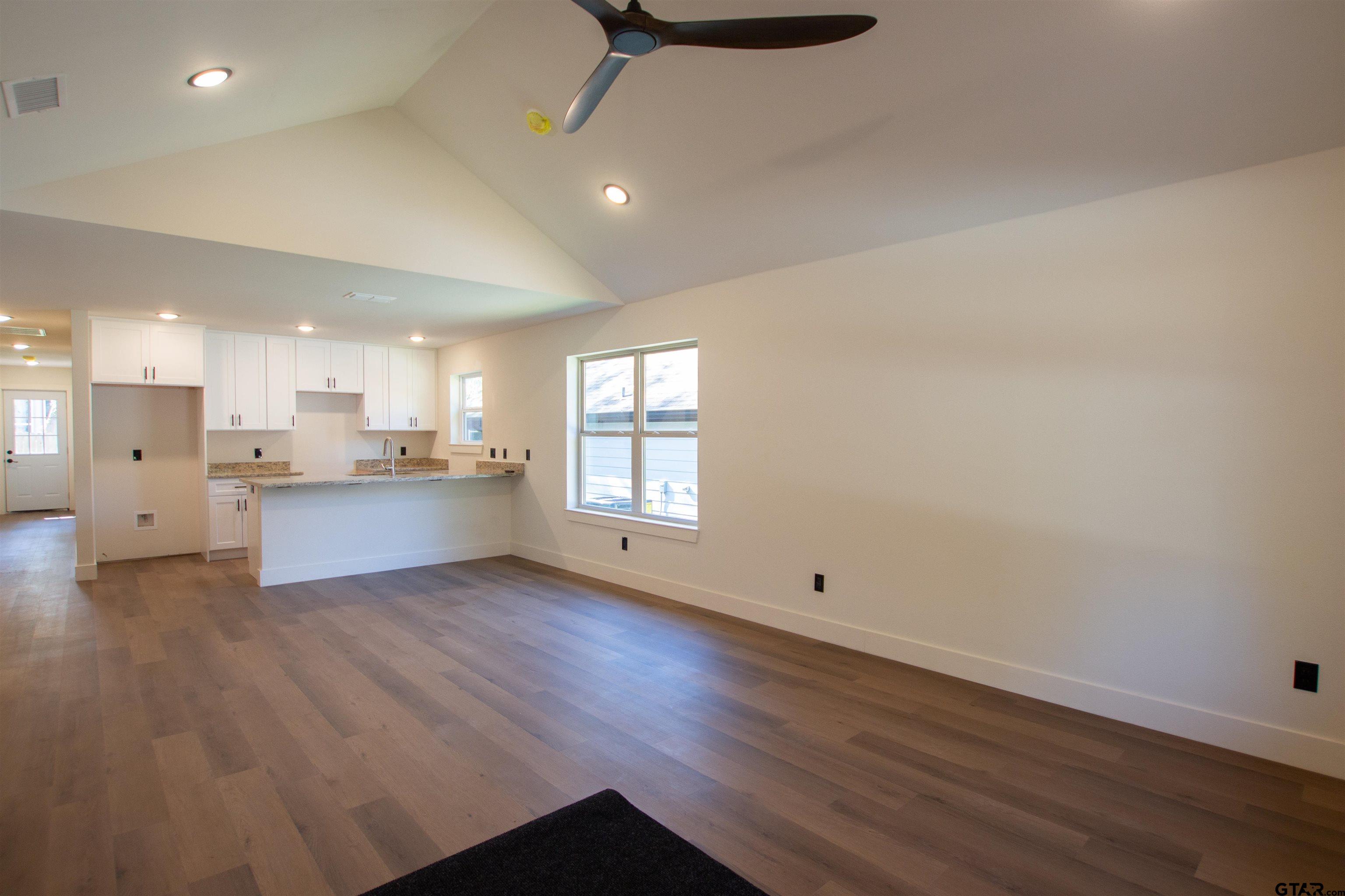 1108 Park Street Tyler, TX 75702 - Photo 5 of 27 a view of kitchen with wooden floor and window