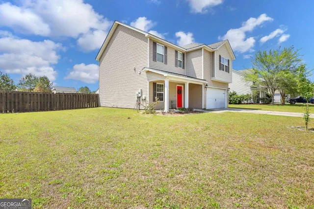 a front view of house with yard and swimming pool