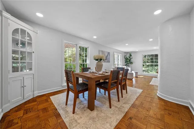a view of a dining room with furniture window and wooden floor
