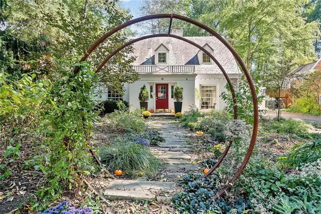 a front view of a house with garden