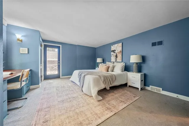 a bedroom with a bed and a cabinets