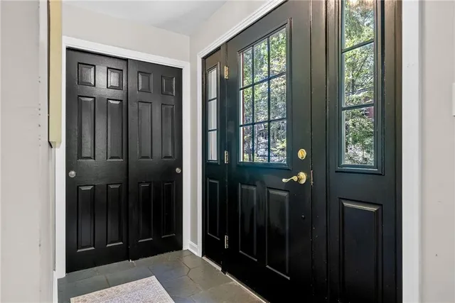 a view of entryway with a front door