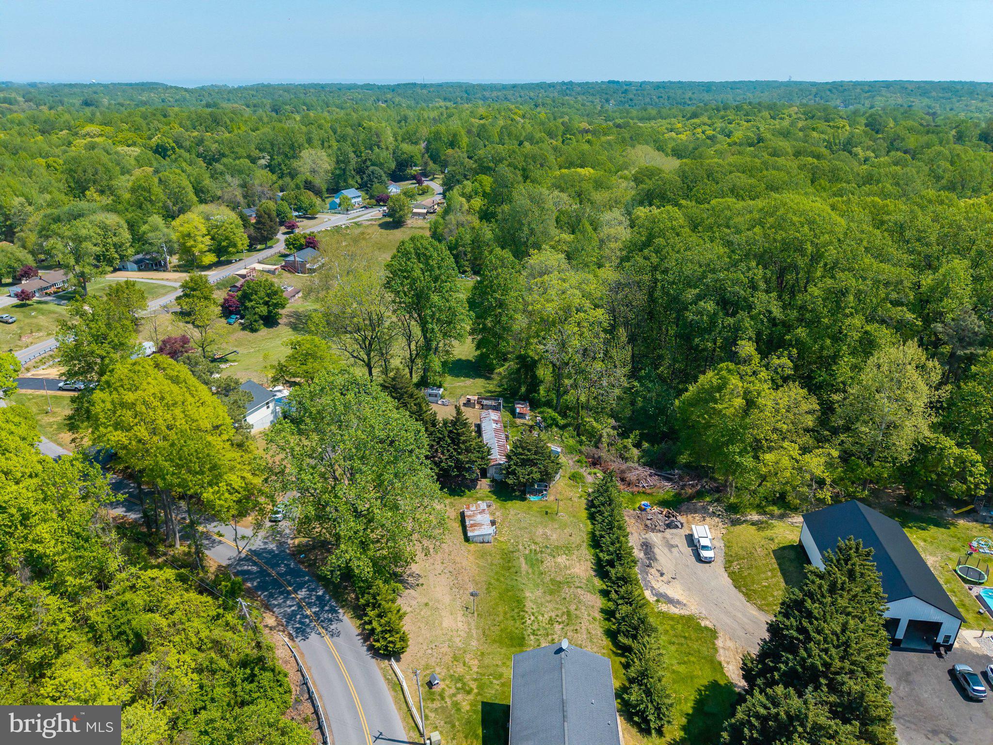 735 Claggett Road Sunderland, MD 20689 - Photo 9 of 11 an aerial view of residential house with outdoor space and trees all around