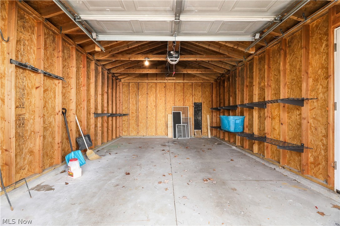 4544 Fishcreek Road Stow, OH 44224 - Photo 36 of 40 Garage featuring a garage door opener