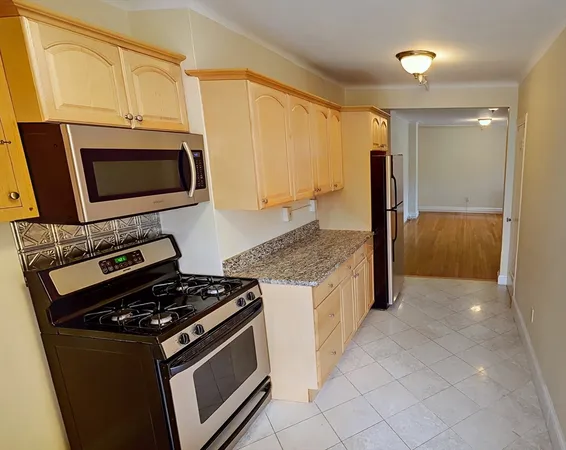 a kitchen with a stove and a microwave