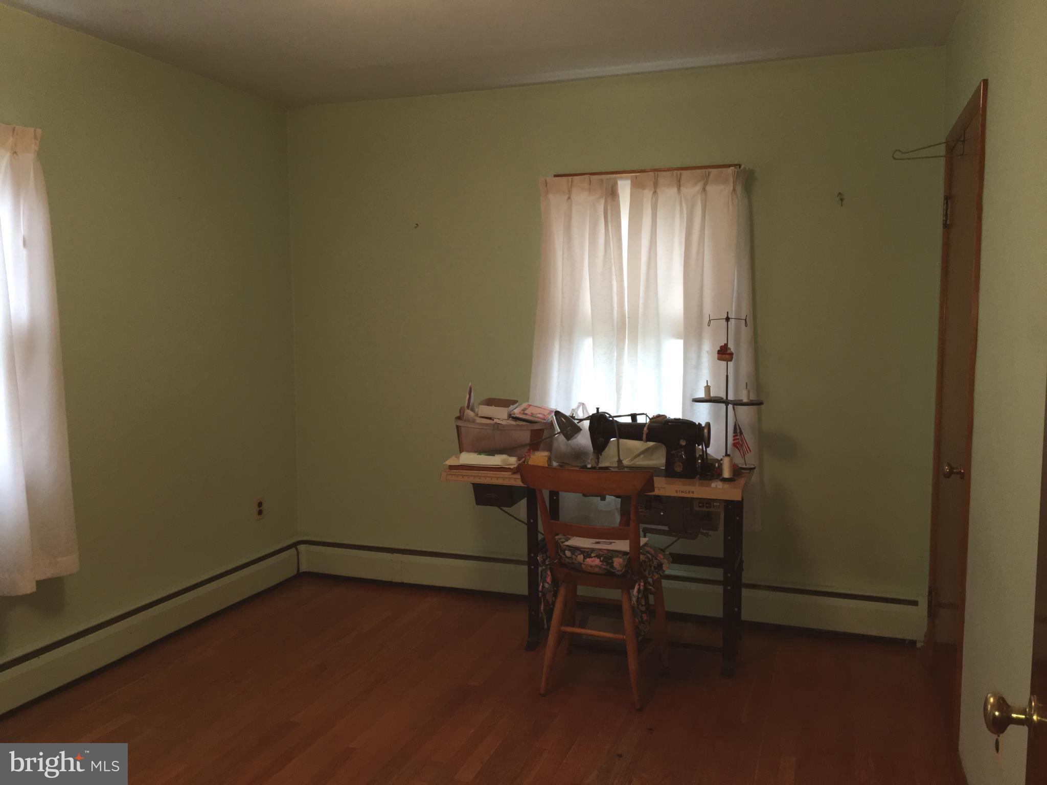 4504 Maple Grove Road Hampstead, MD 21074 - Photo 12 of 12 a view of a workspace with furniture and window