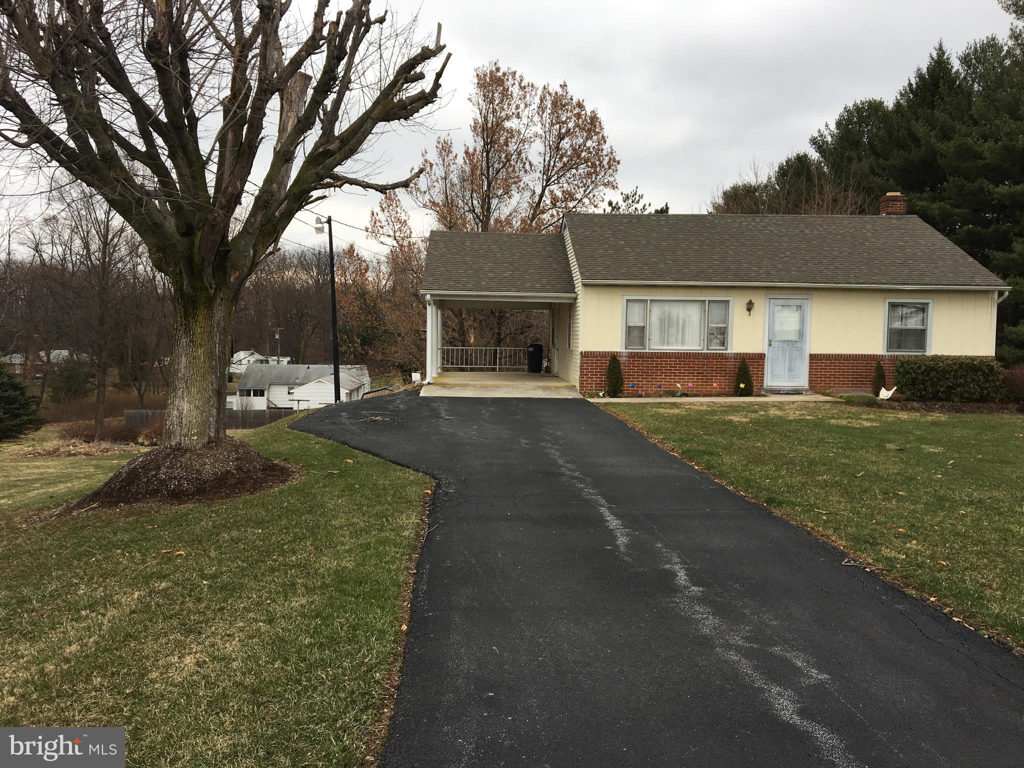 4504 Maple Grove Road Hampstead, MD 21074 - Photo 4 of 12 front view of a house with a yard
