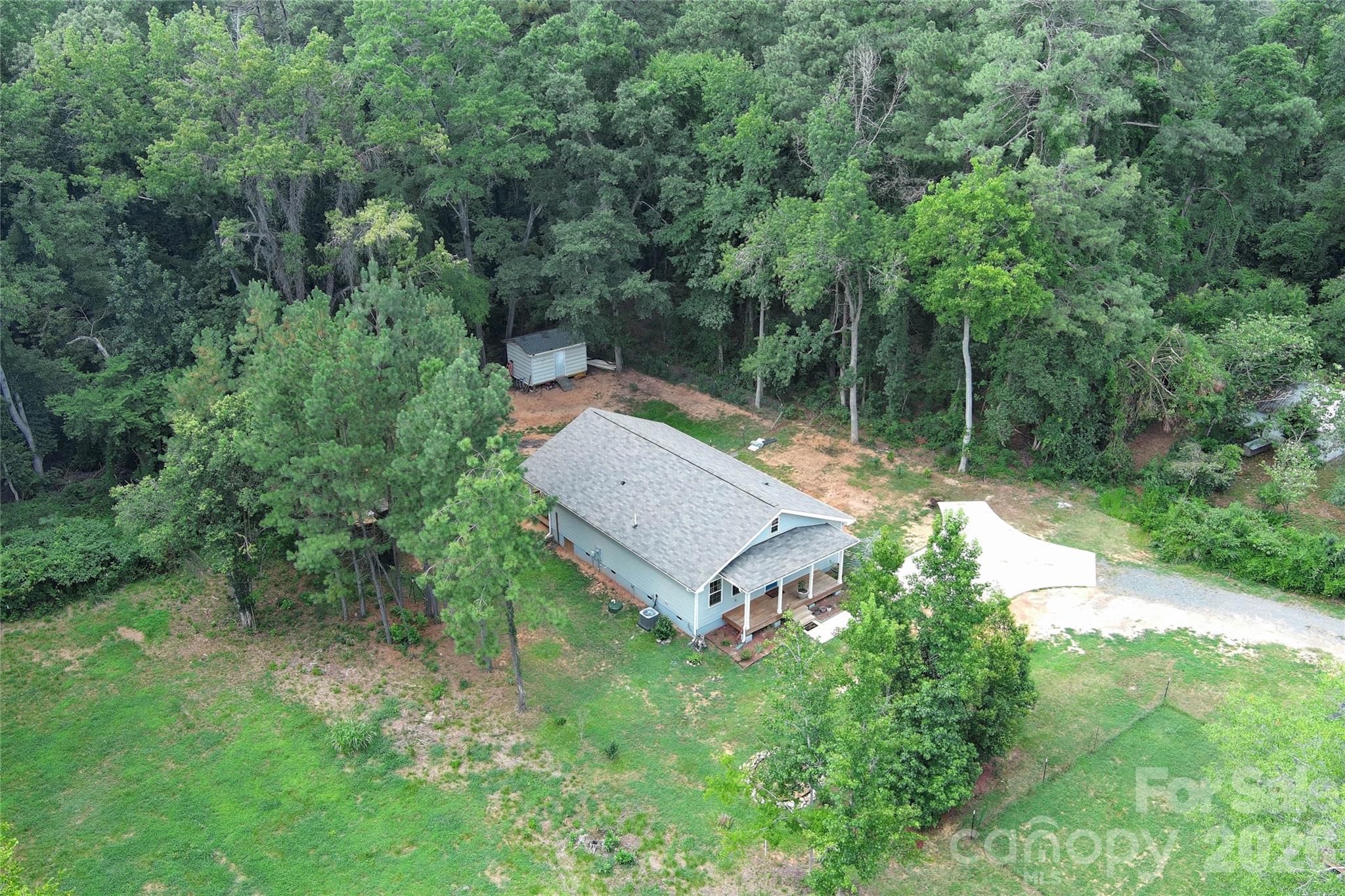 404 White Store Road Wadesboro, NC 28170 - Photo 34 of 38 an aerial view of a house with pool and a yard