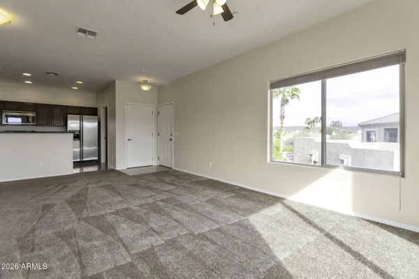 a view of an empty room with a window