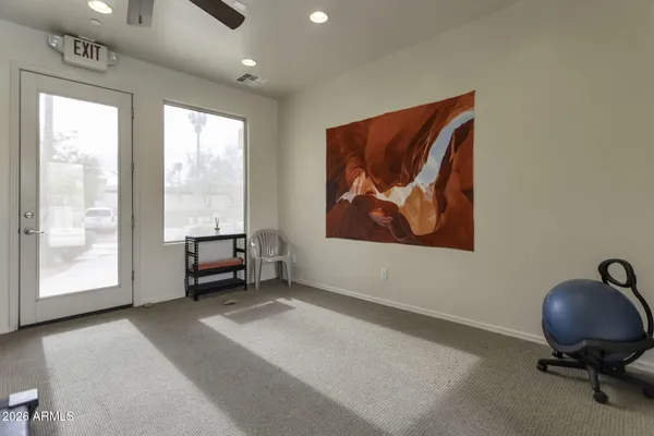a view of workspace with furniture and window