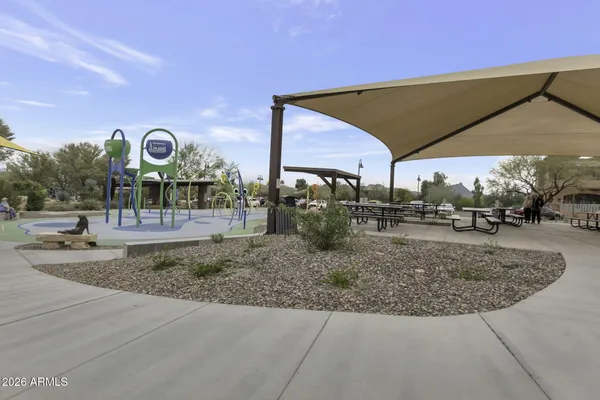 a view of a park with slide and table