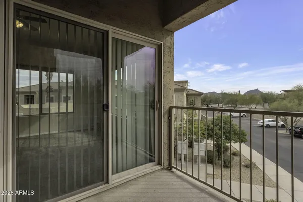 a balcony with a lake view