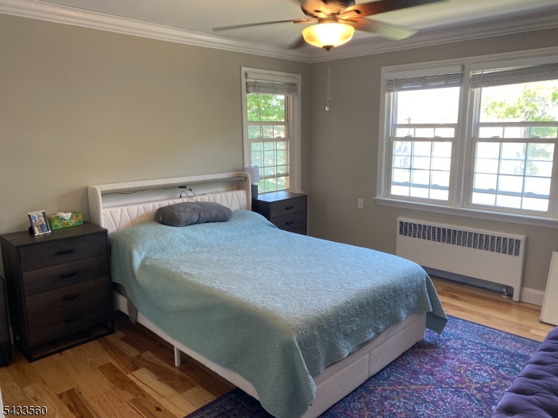 390 Morris Avenue, Unit 4 Summit, NJ 07901 - Photo 7 of 11 a bedroom with a bed and window