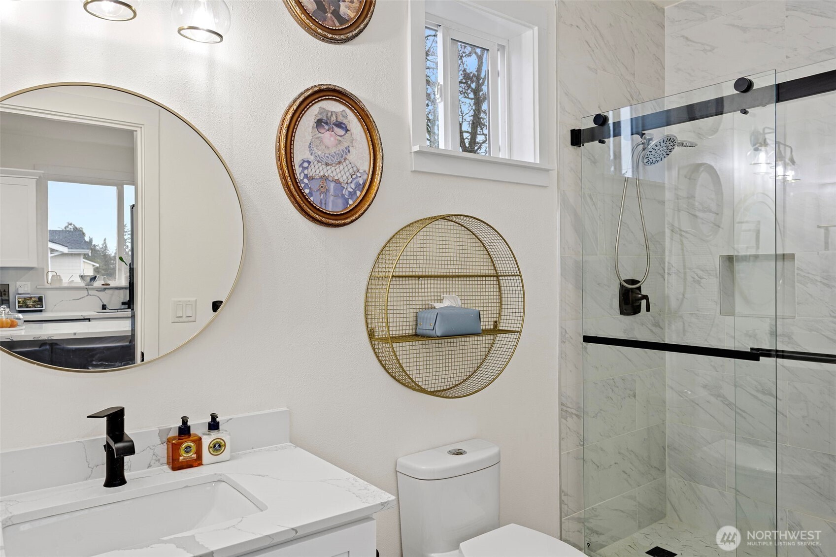 10615 2nd Place Southwest Seattle, WA 98146 - Photo 16 of 28 a bathroom with a toilet a sink and a mirror