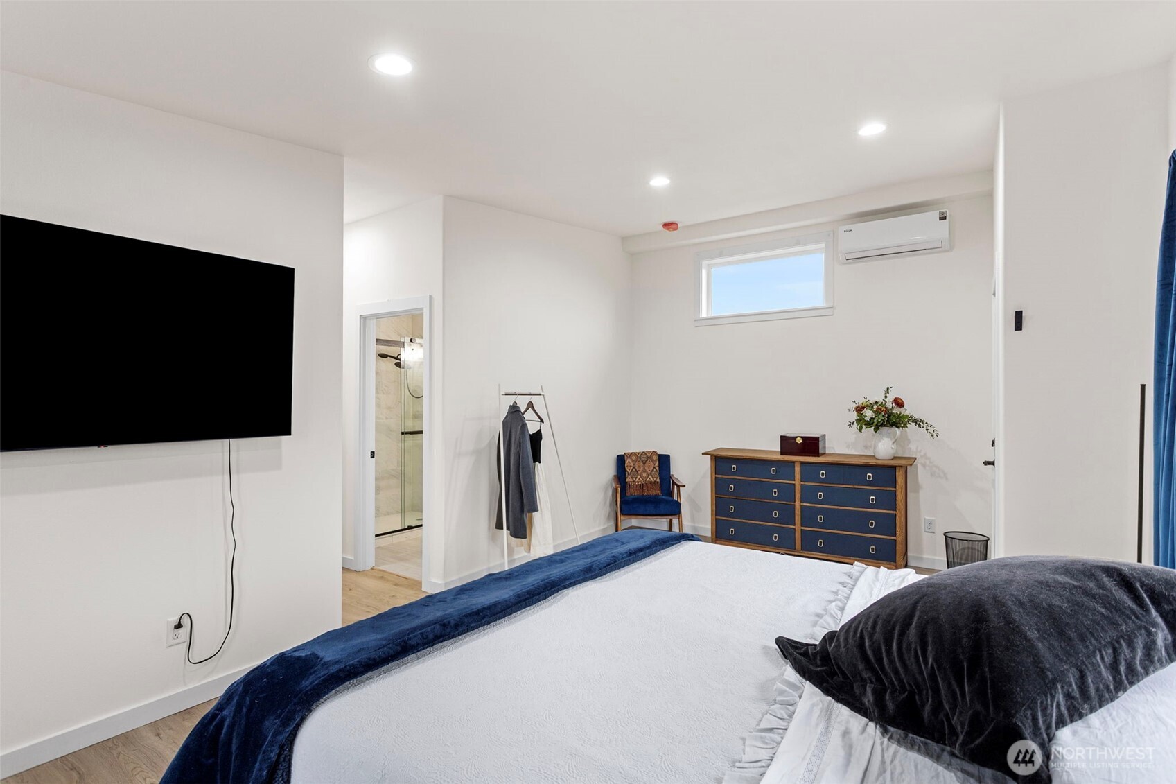 10615 2nd Place Southwest Seattle, WA 98146 - Photo 16 of 28 a bedroom with a bed and a flat screen tv