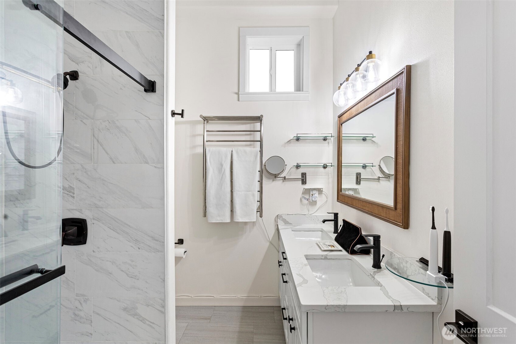 10615 2nd Place Southwest Seattle, WA 98146 - Photo 21 of 28 a bathroom with a sink and mirror with bathtub