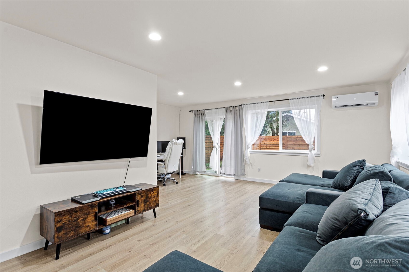 10615 2nd Place Southwest Seattle, WA 98146 - Photo 4 of 28 a living room with furniture and a flat screen tv