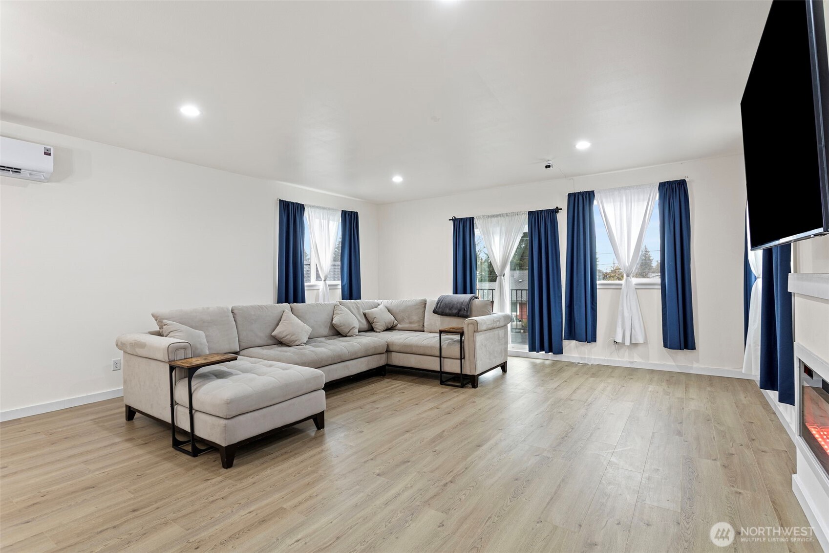 10615 2nd Place Southwest Seattle, WA 98146 - Photo 6 of 28 a living room with furniture and a flat screen tv