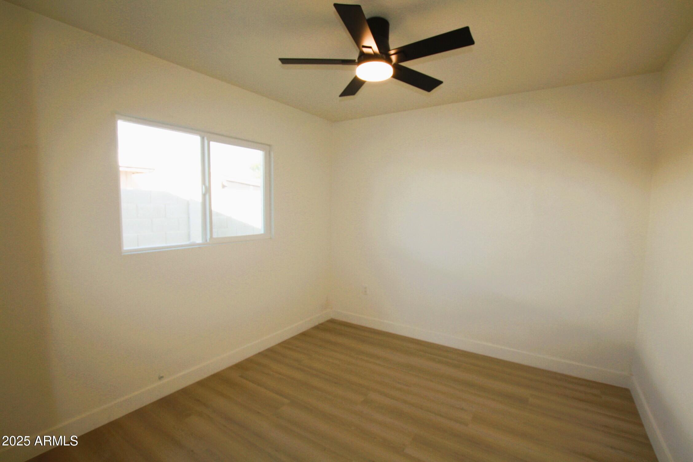 443 North Sycamore Mesa, AZ 85201 - Photo 17 of 33 an empty room with a window and a fan