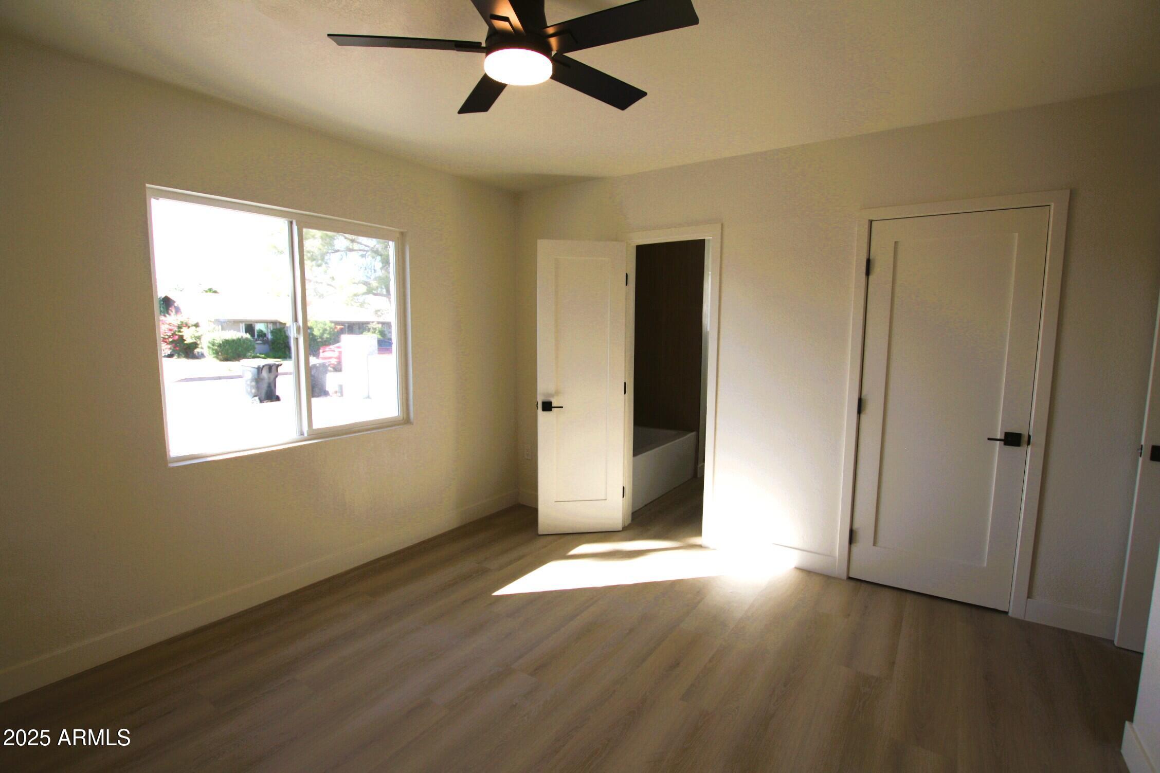 443 North Sycamore Mesa, AZ 85201 - Photo 25 of 33 a view of an empty room with window and wooden floor