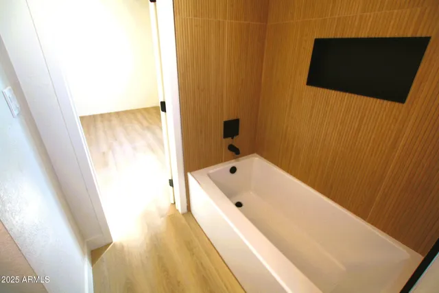 a bathroom with a sink and mirror