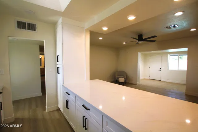 a bathroom with a sink a vanity and a mirror