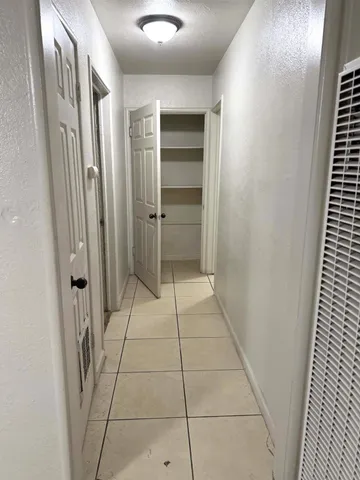 a bathroom with a shower and a mirror