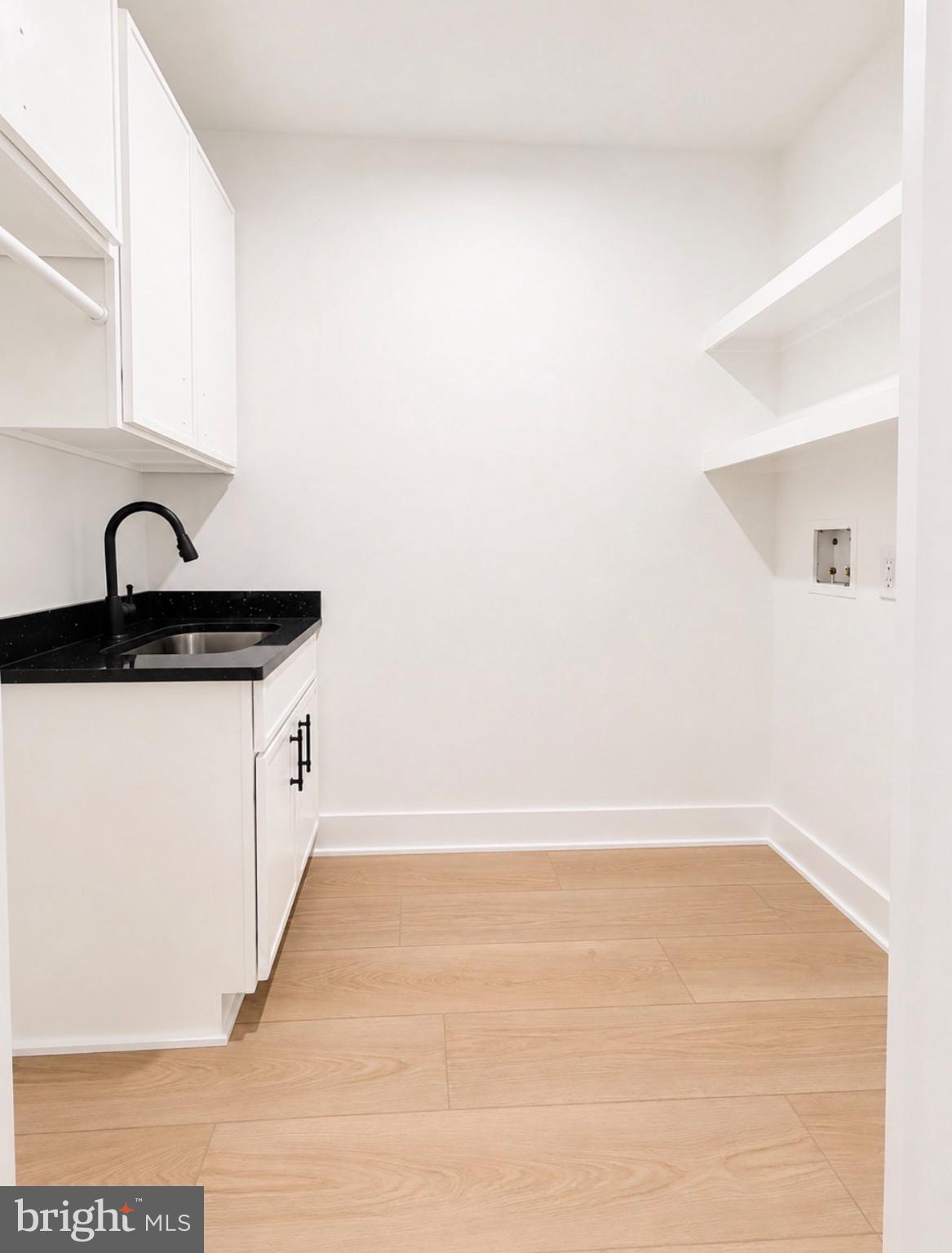 21963 Hardscrabble Road Georgetown, DE 19947 - Photo 17 of 43 Sleek utility space with modern finishes.