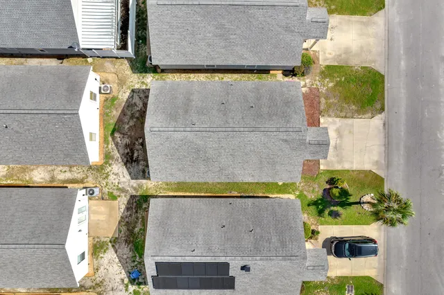 an aerial view of residential houses with outdoor space