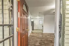 a view of gallery with large windows