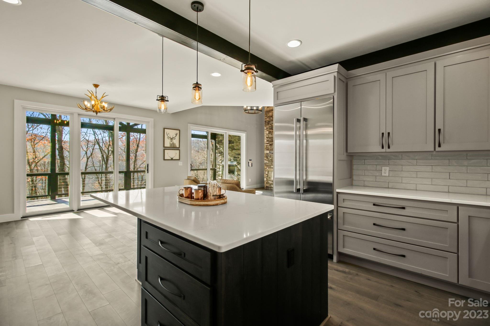 1736 Twin Rivers Drive Boone, NC 28607 - Photo 12 of 48 a kitchen with a sink and cabinets