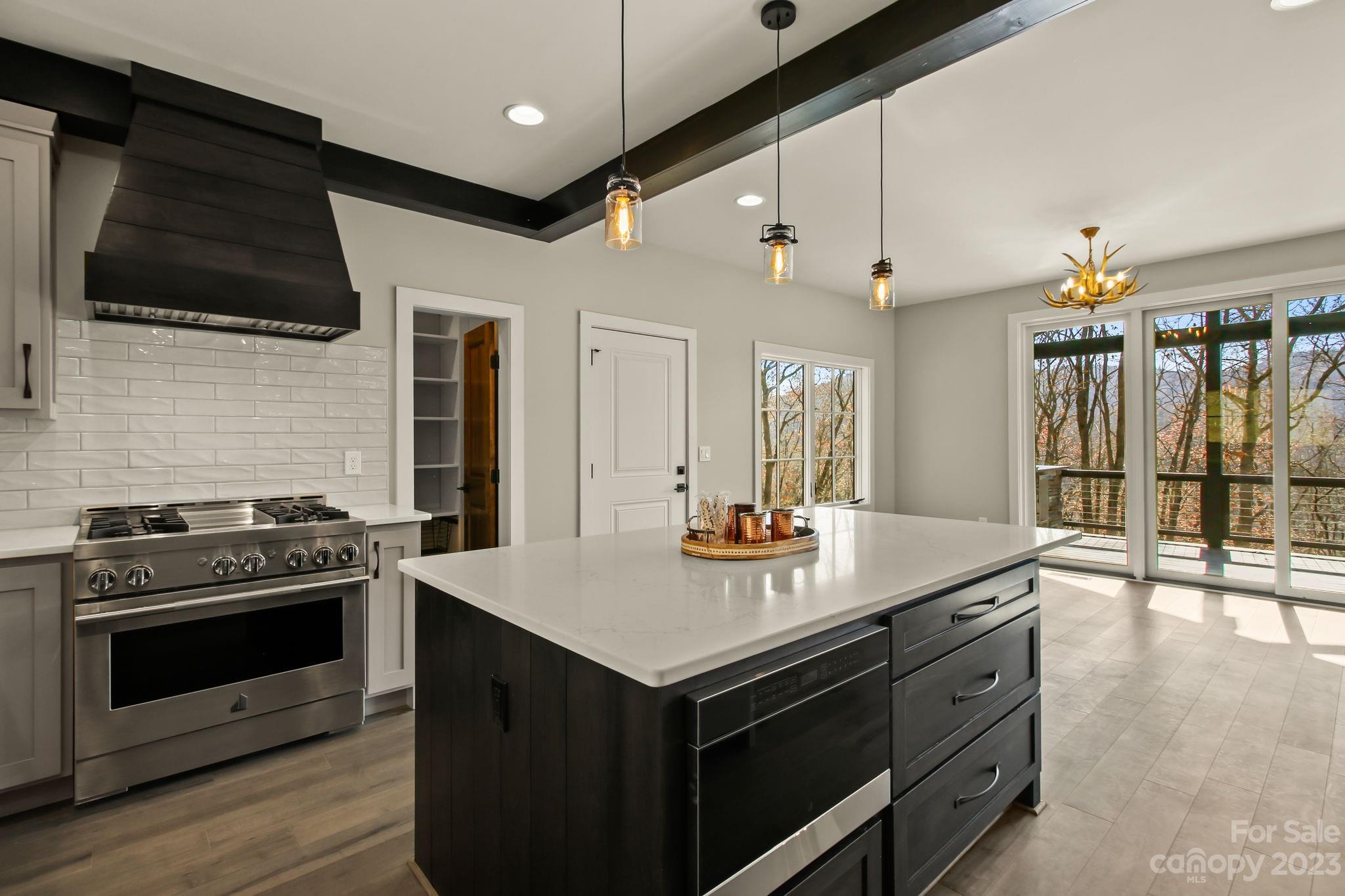 1736 Twin Rivers Drive Boone, NC 28607 - Photo 13 of 48 a kitchen with a stove and a microwave