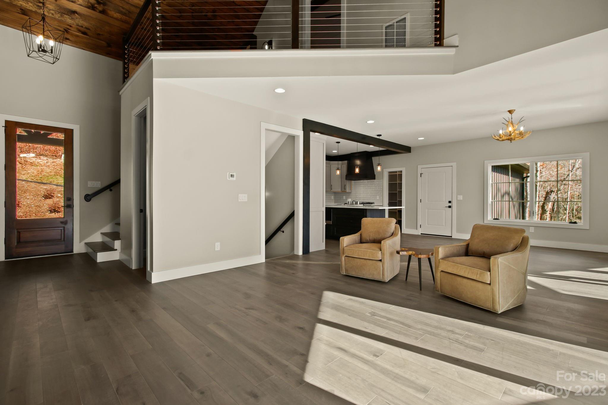 1736 Twin Rivers Drive Boone, NC 28607 - Photo 19 of 48 a living room with furniture and a potted plant