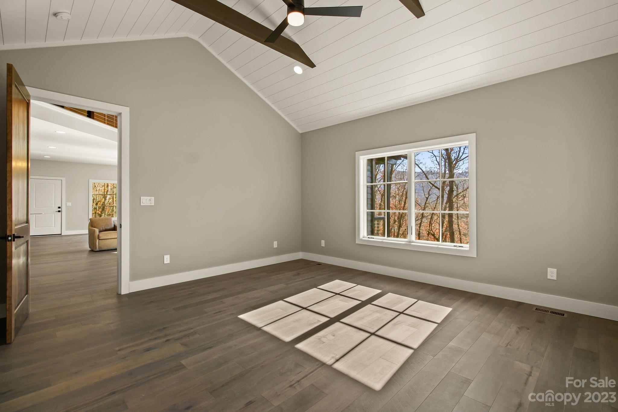 1736 Twin Rivers Drive Boone, NC 28607 - Photo 20 of 48 an empty room with wooden floor and windows
