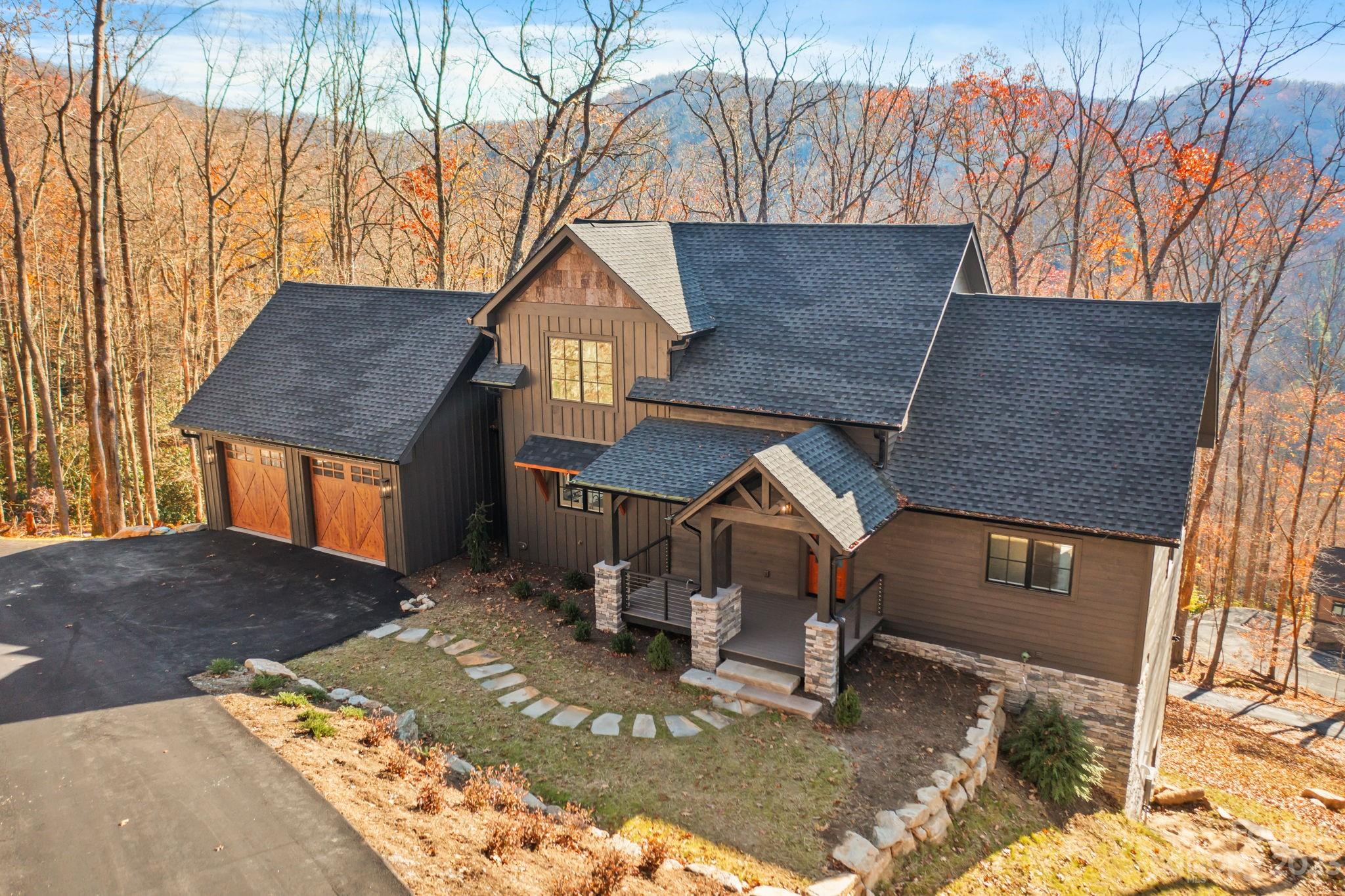 1736 Twin Rivers Drive Boone, NC 28607 - Photo 2 of 48 a front view of a house with a yard