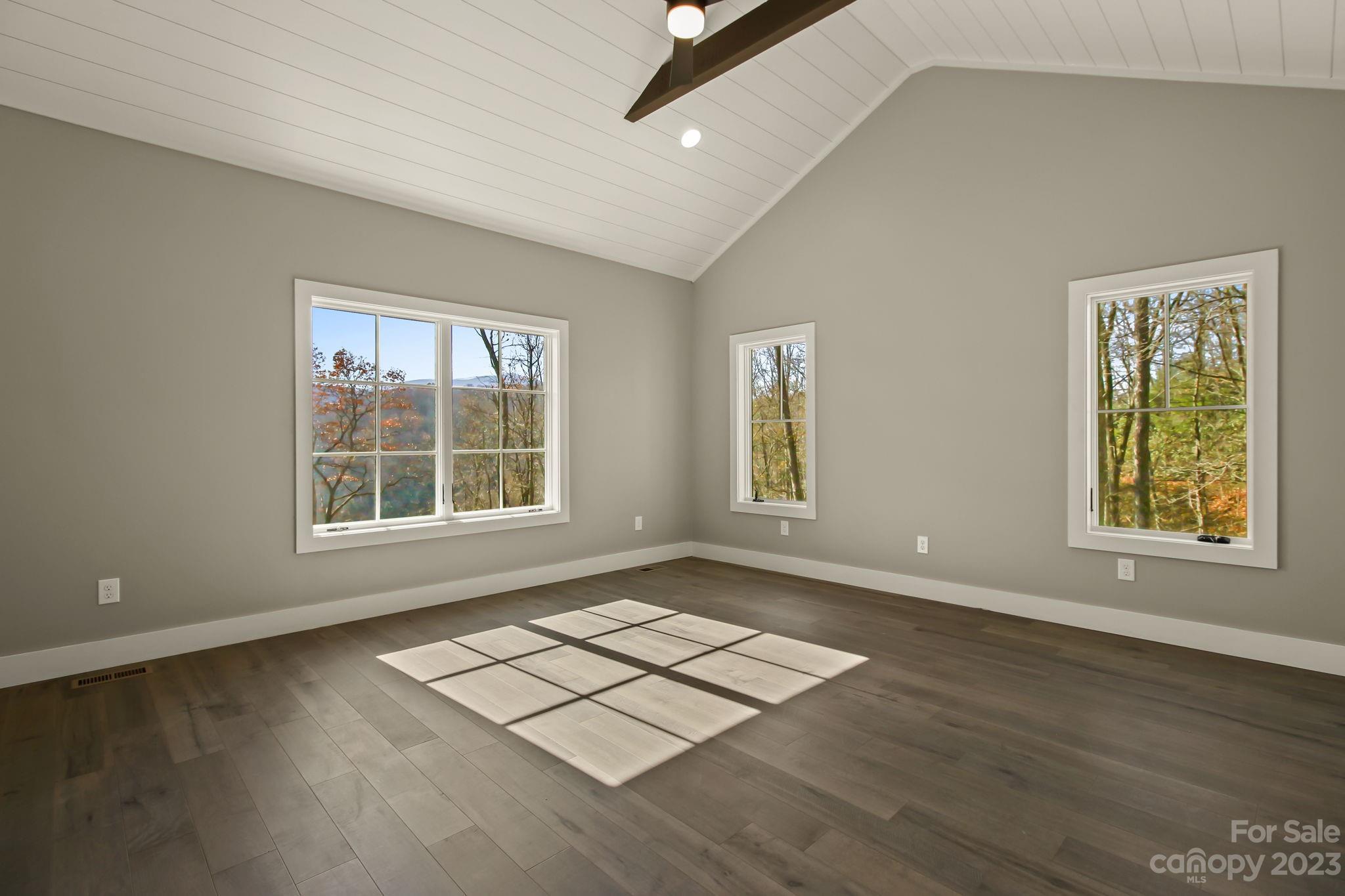 1736 Twin Rivers Drive Boone, NC 28607 - Photo 21 of 48 an empty room with wooden floor and windows