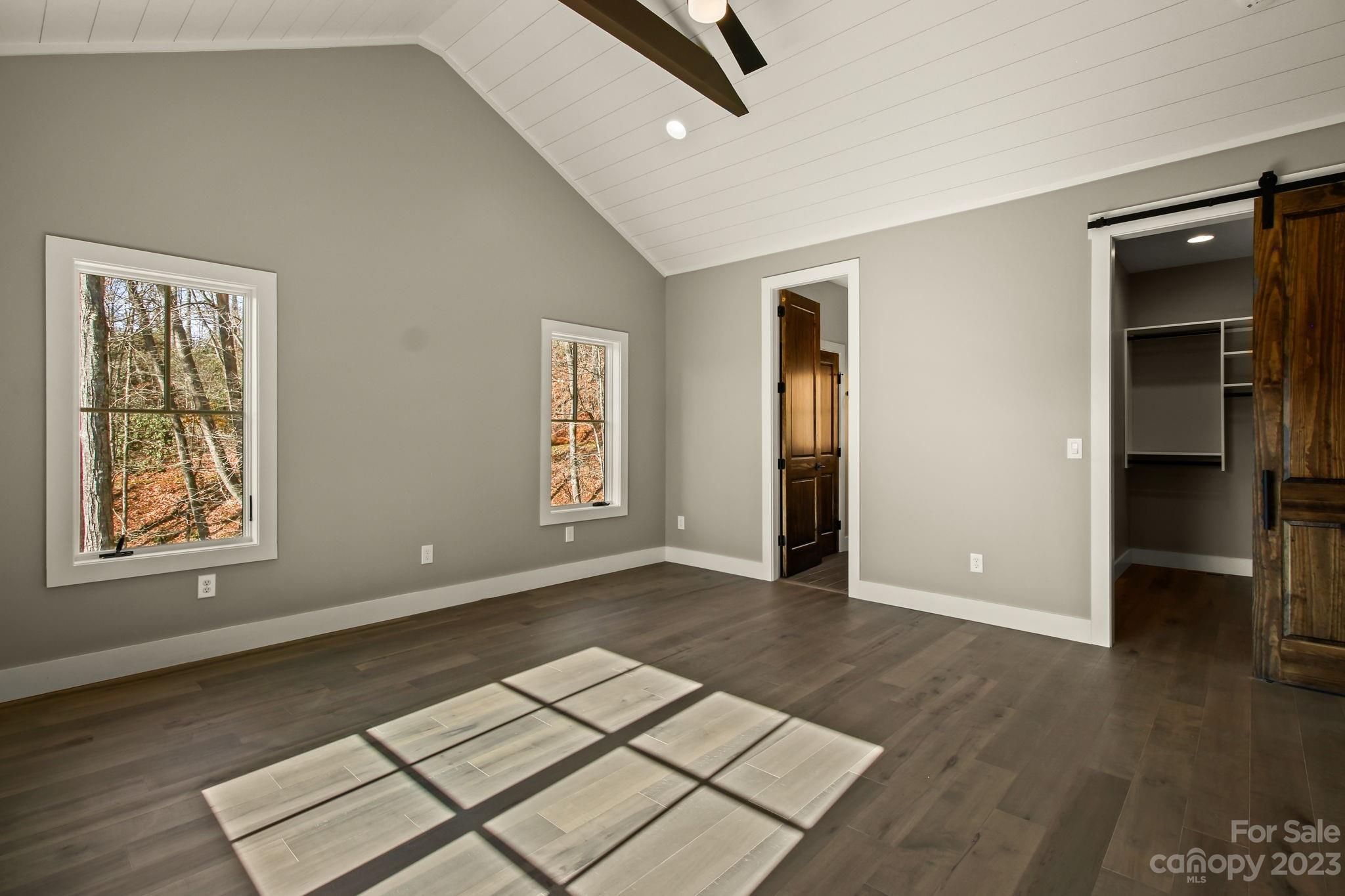 1736 Twin Rivers Drive Boone, NC 28607 - Photo 22 of 48 an empty room with wooden floor cabinet and windows